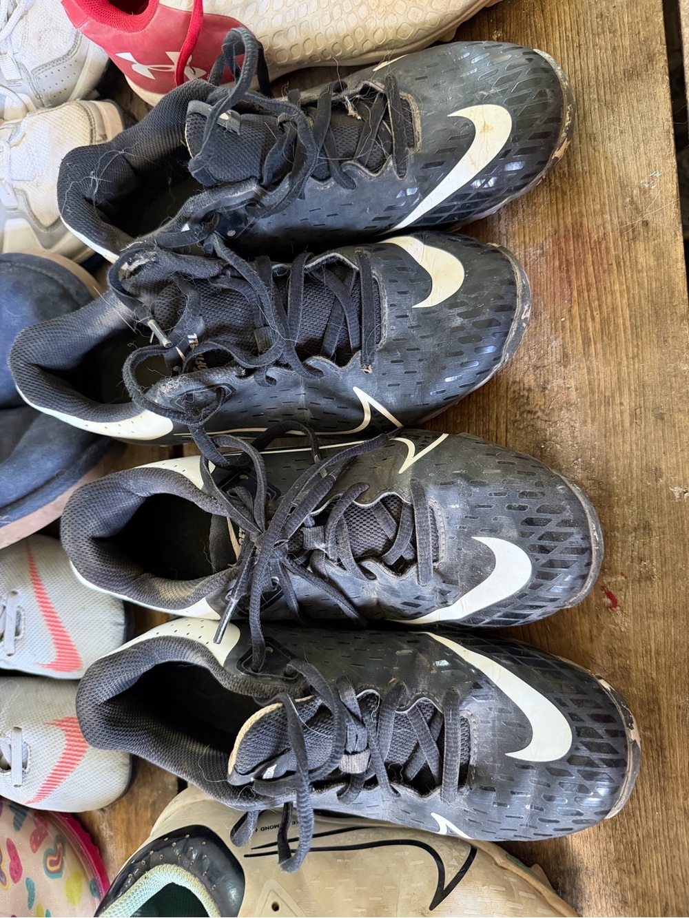 Nike Kids Black Softball Cleats with White Swoosh